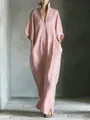 Elegant detail view of a minimalist pink V-neck maxi dress with loose mid-sleeves - Pink