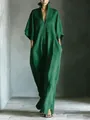 Elegant emerald green V-neck maxi dress with a loose fit, mid-sleeves, and pockets - S / Dresses / Green