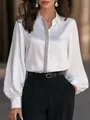 Detailed view of elegant white satin blouse with lantern sleeves and silver sequin trim - S / Tops / White