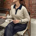 Elegant beige long-sleeved polo knit sweater featuring navy blue contrast collar and cuffs - S / Tops / Light Khaki