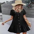 Detalle de vestido de algodón y lino negro con botones y dobladillo con volantes. - S / Vestidos / Negro