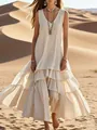 Close-up detail of cream cotton-linen sleeveless maxi dress featuring tiered ruffled hem - S / Dresses / Apricot
