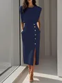 Detailed shot of the elegant navy blue dress with gold buttons and a high side slit. - S / Dresses / Navy Blue