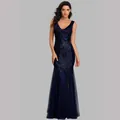 Detail view of navy blue sequined mermaid evening gown with deep V-neck and tulle flare - Dark Blue