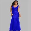 Elegant royal blue sequined mermaid evening gown with V-neckline and slim fit design. - Blue