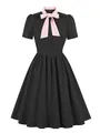 Vintage 1950s retro black dress with contrasting pink bow tie collar and pleated skirt - Black with Pink