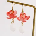 Close-up of elegant red flower petal earrings with a white teardrop pendant detail - Red Ice Flower Style (DZ-398)