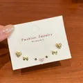 Minimalist gold stud earring set featuring heart, bow, and star designs for daily wear - Gold Pentagram Earring Set (JTZT001)
