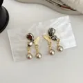 Elegant gold butterfly earrings with dark crystals and dangling pearls - Black Gold Butterfly Double Pearl Earrings (RO2)