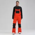 Vibrant orange and black waterproof ski bib pants for women winter sports performance - Orange And Black