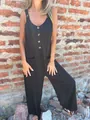 Detailed close-up view of a casual black jumpsuit with button front and side pockets - 4XL / Dresses / Black