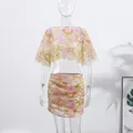 Detailed view of floral embroidery and sequins on two-piece cropped top and skirt set - S / Top And Bottom / Pink Short Skirt Set