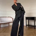 Elegant black women's suit featuring sequin floral embroidery and wide-leg trousers - S / Top And Bottom / Black