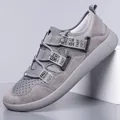Side view of gray thick-sole retro sneakers with mesh and suede texture details. - 39 / Gray