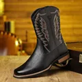Detailed side view of black Western cowboy boots featuring decorative embroidery and V-neck - 39 / Black