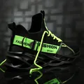 Vue détaillée de la basket fly-woven noire et vert néon avec semelle à lame unique - 36 / Noir Vert