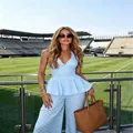 Model wearing a light blue polka dot halter peplum top and wide-leg trousers set - XL / Top And Bottom / Sky Blue