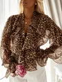Detail of leopard print chiffon blouse featuring layered ruffles and flared sleeves. - S / Tops / Leopard Print