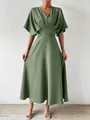 Close-up view of a green V-neck midi dress with waist-tightening detail and batwing sleeves - S / Dresses / Grey Green