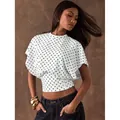 Retro white polka dot short top with batwing sleeves and cinched waist for women - S / Tops / White
