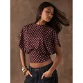 Retro burgundy polka dot crop top featuring batwing sleeves and a flattering cinched waist - S / Tops / Brown