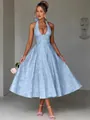 Detailed view of the light blue jacquard texture on an elegant V-neck halter maxi dress - S / Dresses / Blue