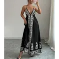 Chic black and white floral print halter maxi dress for elegant summer outfits - S / Dresses / Black