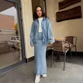 Detailed view of women's denim two-piece set featuring a zip-up jacket and mermaid skirt - XS / Top And Bottom / Light Blue