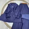 Close-up detail of the navy blue linen blazer and matching long skirt two-piece set. - XS / Top And Bottom / Dark Blue