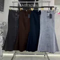 Set of high waist retro mermaid maxi skirts in four different colors hanging on a rack. - L / Bottoms / Navy Blue