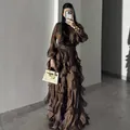 Elegant brown evening gown featuring intricate pleated ruffles and long-sleeved silhouette. - XS / Dresses / Brown