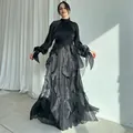 Elegant black satin maxi evening gown featuring tiered ruffles and voluminous long sleeves - XS / Dresses / Black