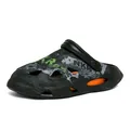 Men's black clog beach shoes with stylish graffiti print and vibrant orange accents - 39 / Black Orange Floral