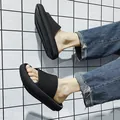 Men's black platform slide sandals with textured mesh strap on grid background. - 38 / Black