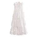 Detailed view of white strapless maxi dress featuring 3D floral lace and tiered ruffles - S / Dresses / White