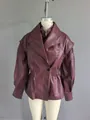 Detailed view of burgundy faux leather jacket with lantern sleeves on mannequin. - S / Tops / Burgundy