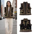 Bohemian chic black velvet vest featuring golden paisley embroidery and plush faux fur trim - S / Tops / Black