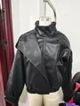 Close-up of black lychee-patterned faux leather jacket with high collar and asymmetric zip - S / Tops / Classic Black