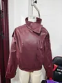 Detailed macro shot of vintage burgundy faux leather jacket with litchi texture - S / Tops / Burgundy