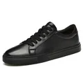Stylish men's black low-top casual leather sneakers with matching laces and soles - 36 / Black