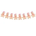 Guirnalda navideña de hombre de jengibre en acuarela con lazos rosas y gorros decorativos - Pancarta de Hombre de Jengibre Rosa