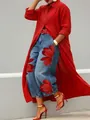Close-up detail of stylish long red button-up shirt and floral print denim jeans set - S / Dresses / Red