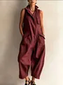 Detailed view of the sleeveless burgundy jumpsuit with utility pockets and wide legs - Burgundy