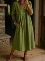 Detail showing the V-neck and lace trim of the green cotton linen dress. - S / Olive