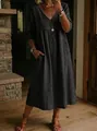 Detail view of the elegant charcoal cotton linen dress with V-neck and lace trim - S / Dresses / Black