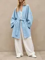 Full-length view of a women's loose light blue belted cardigan jacket with white pants. - S / Tops / Sky Blue