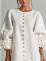 Close-up of 3D floral cuffs and textured buttons on a white linen lantern sleeve dress - XS / Dresses / White