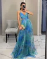 Elegant blue and green mesh printed camisole maxi dress shown in a mirror selfie - Malachite green