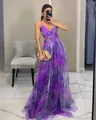 Close-up detail of a vibrant purple floral mesh camisole maxi dress with waist cutout - S / Dresses / Purple