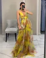 Detailed look at the vibrant yellow watercolor print mesh maxi dress with waist cut-outs - Yellow